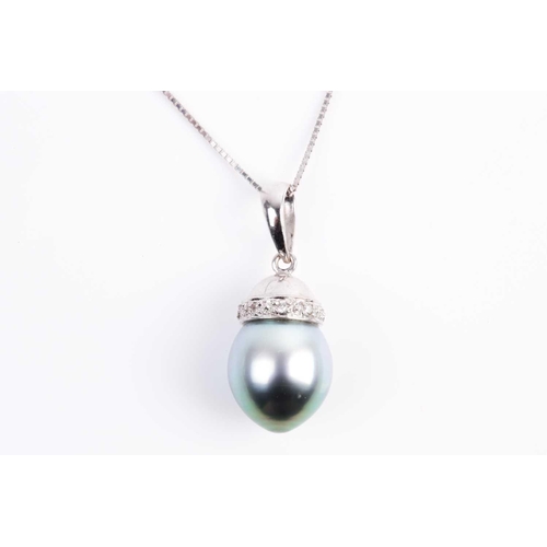 63 - A single stone Tahitian pearl and diamond pendant, the ovoid pearl with circular-cut diamond set aco... 