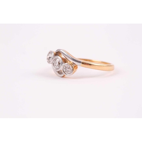 64 - An 18ct yellow gold and diamond crossover ring, set with three round-cut diamonds of approximately 0... 