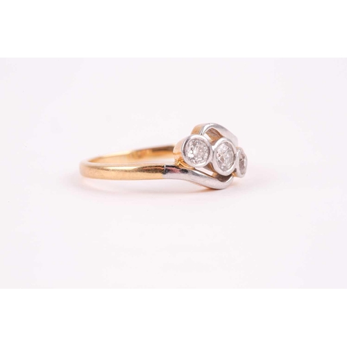 64 - An 18ct yellow gold and diamond crossover ring, set with three round-cut diamonds of approximately 0... 