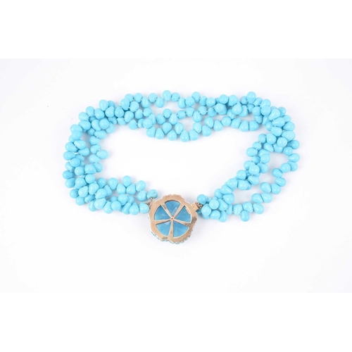 70 - A turquoise-coloured bead necklace, possibly dyed howlite, set with three strands of rounded pear-sh... 