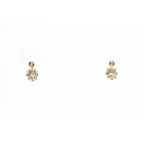 86 - A pair of diamond and emerald cluster drop earrings, each set with a mixed oval-cut emerald within a... 