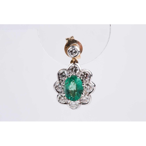 86 - A pair of diamond and emerald cluster drop earrings, each set with a mixed oval-cut emerald within a... 