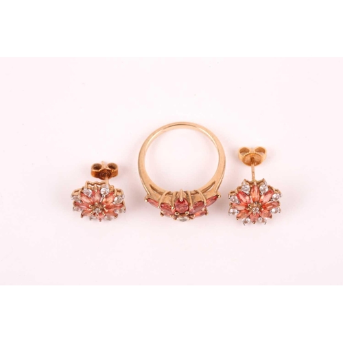 89 - An orange and white sapphire cluster ring, the foliate cluster to a plain 9ct gold shank, with a pai... 