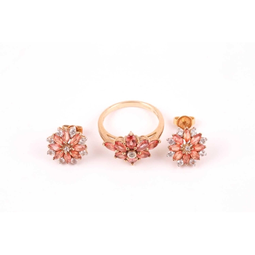 89 - An orange and white sapphire cluster ring, the foliate cluster to a plain 9ct gold shank, with a pai... 