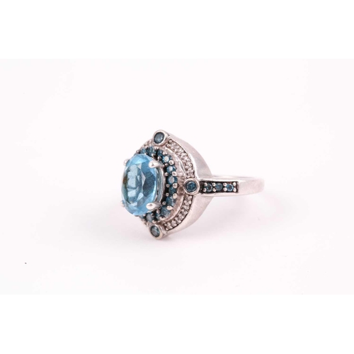 91 - A silver, topaz, and diamond ring, set with a mixed oval-cut blue topaz, surrounded with small blue ... 