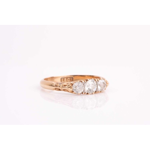 92 - A late Victorian three stone diamond half hoop ring, the slightly graduated old brilliant cut diamon... 