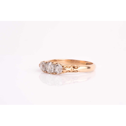 92 - A late Victorian three stone diamond half hoop ring, the slightly graduated old brilliant cut diamon... 