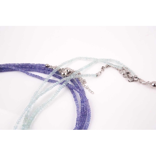 106 - An unusual tanzanite beaded necklace, comprised of three connected strands of faceted beads, with ma... 