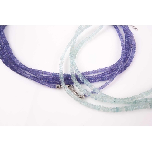 106 - An unusual tanzanite beaded necklace, comprised of three connected strands of faceted beads, with ma... 