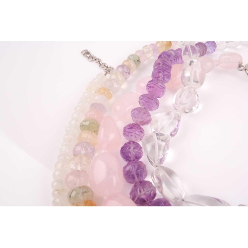 58 - A chunky rose quartz beaded necklace, together with a faceted moonstone beaded necklace, a clear qua... 