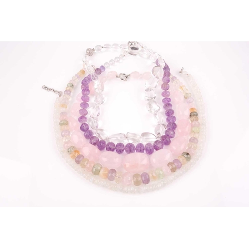 58 - A chunky rose quartz beaded necklace, together with a faceted moonstone beaded necklace, a clear qua... 