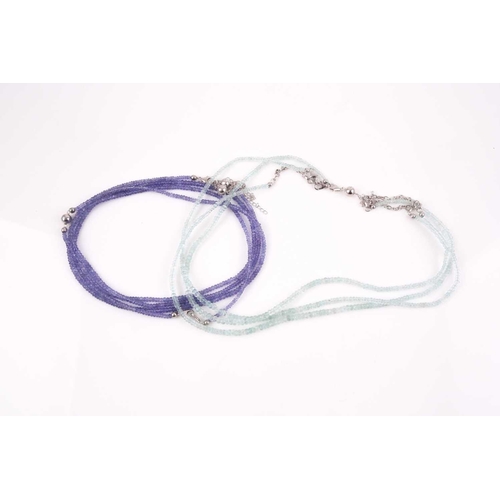 106 - An unusual tanzanite beaded necklace, comprised of three connected strands of faceted beads, with ma... 