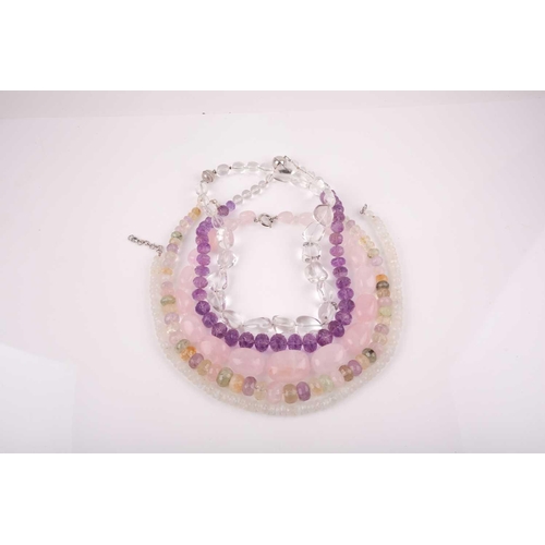 58 - A chunky rose quartz beaded necklace, together with a faceted moonstone beaded necklace, a clear qua... 