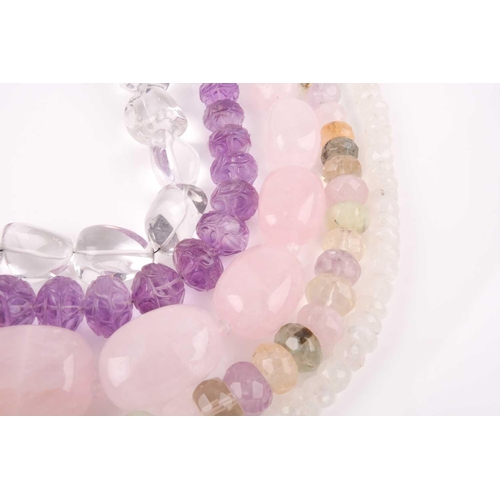 58 - A chunky rose quartz beaded necklace, together with a faceted moonstone beaded necklace, a clear qua... 