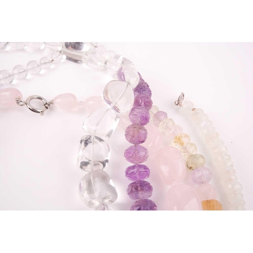 58 - A chunky rose quartz beaded necklace, together with a faceted moonstone beaded necklace, a clear qua... 