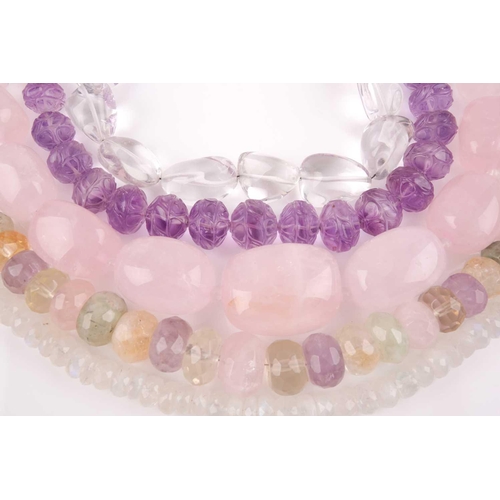 58 - A chunky rose quartz beaded necklace, together with a faceted moonstone beaded necklace, a clear qua... 