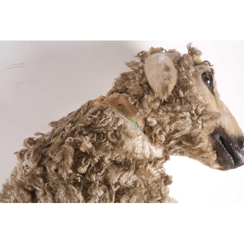 1 - Nancy Fouts (American, 1945-2019), a lifesize resin and faux-skin model of a small sheep in an anthr... 