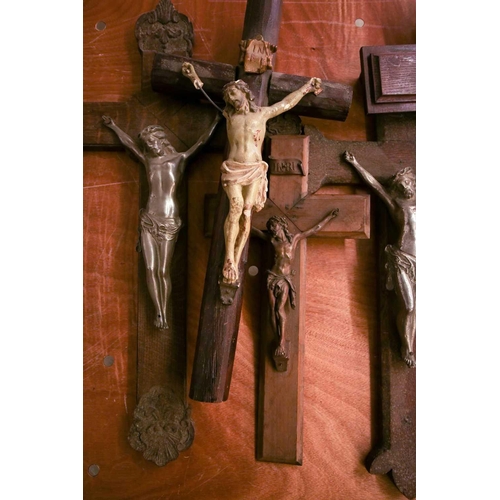 101 - A collection of large antique crucifixes, predominately 19th century British and European. To includ... 