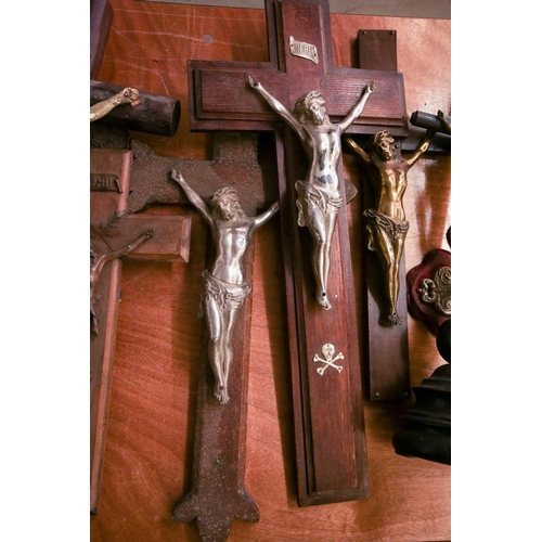 101 - A collection of large antique crucifixes, predominately 19th century British and European. To includ... 