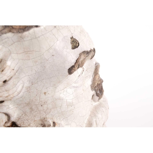 103 - A 19th-century white glazed pottery head of an Elizabethan gentleman with a laurel wreath about his ... 