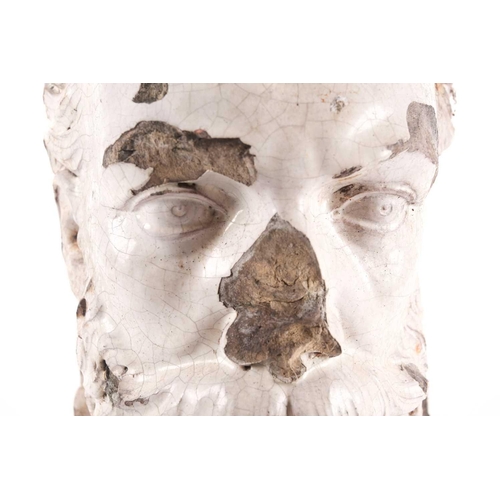 103 - A 19th-century white glazed pottery head of an Elizabethan gentleman with a laurel wreath about his ... 