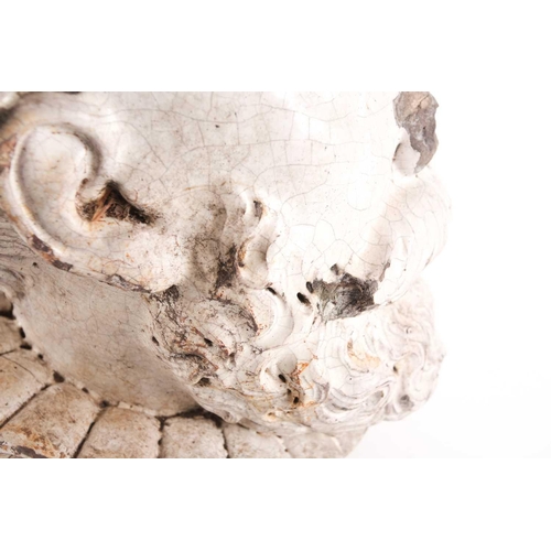 103 - A 19th-century white glazed pottery head of an Elizabethan gentleman with a laurel wreath about his ... 