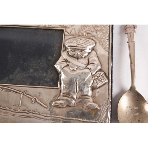 14 - A late 20th century embossed, rectangular novelty silver photograph frame. London 1986, maker not fo... 