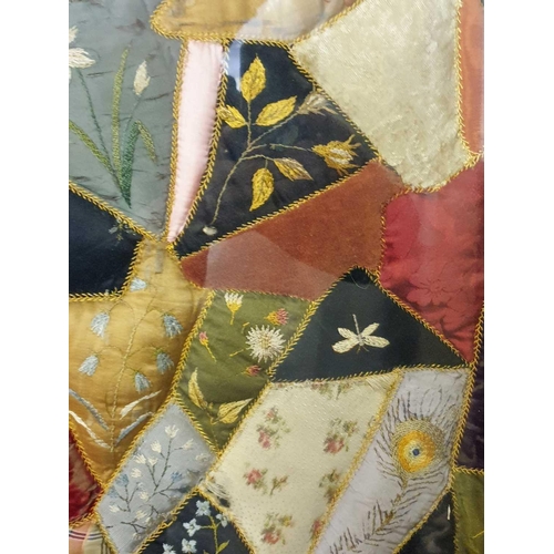 43 - A framed late 19th century possibly American patchwork quilt of irregular segments including silks, ... 