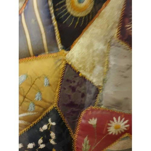 43 - A framed late 19th century possibly American patchwork quilt of irregular segments including silks, ... 