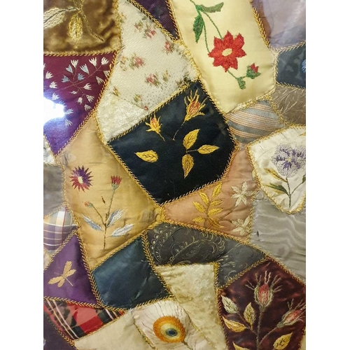 43 - A framed late 19th century possibly American patchwork quilt of irregular segments including silks, ... 