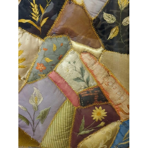 43 - A framed late 19th century possibly American patchwork quilt of irregular segments including silks, ... 