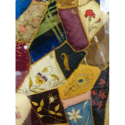 43 - A framed late 19th century possibly American patchwork quilt of irregular segments including silks, ... 