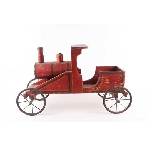 53 - A vintage, presumably American folk art, crimson painted wood, pull along steam engine with spoked w... 