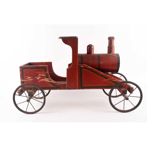 53 - A vintage, presumably American folk art, crimson painted wood, pull along steam engine with spoked w... 