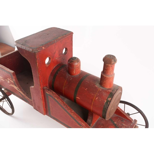 53 - A vintage, presumably American folk art, crimson painted wood, pull along steam engine with spoked w... 