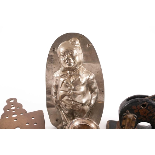 57 - A small collection of decorative items including a Vintage Schwarzer chocolate mould in the form of ... 