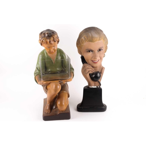 63 - An Art Deco period painted plaster advertising display of a blonde lady holding a telephone, with gl... 