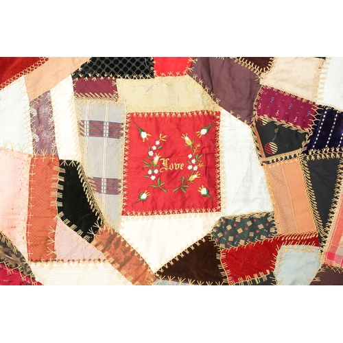 74 - A late 19th century possibly American patchwork quilt of satin, velvet, damasks, and other fabrics a... 