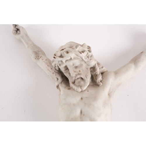 86 - An early 20th century Continental bisque porcelain corpus of the crucified Christ. Bearing indistinc... 