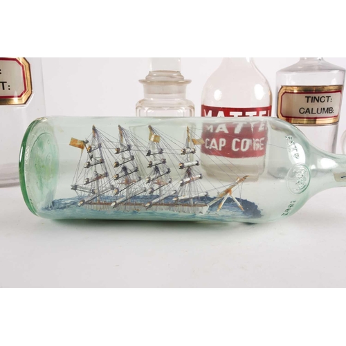 94 - A late 20th-century model ship in a bottle, together with various other glassware to include several... 