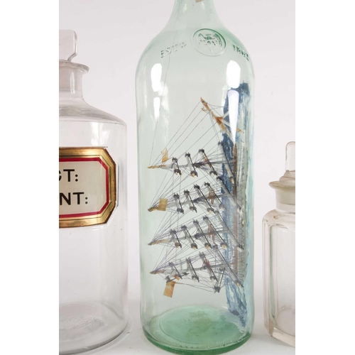 94 - A late 20th-century model ship in a bottle, together with various other glassware to include several... 