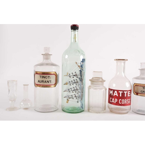 94 - A late 20th-century model ship in a bottle, together with various other glassware to include several... 