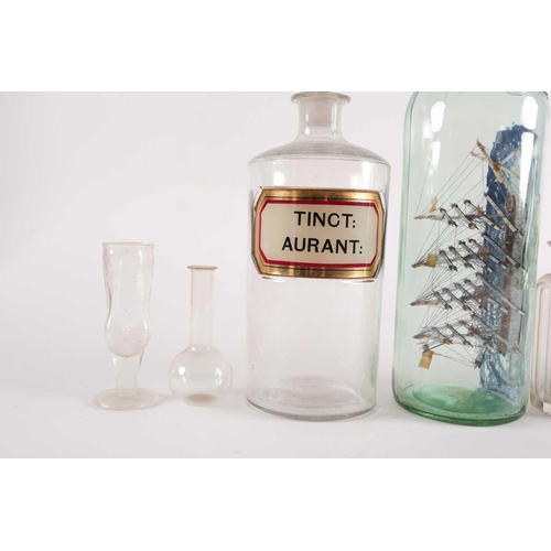 94 - A late 20th-century model ship in a bottle, together with various other glassware to include several... 