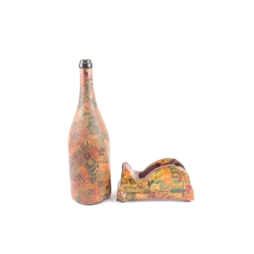 99 - A mid 20th century decoupaged wine bottle appliqued with vintage and antique postage stamps, togethe... 