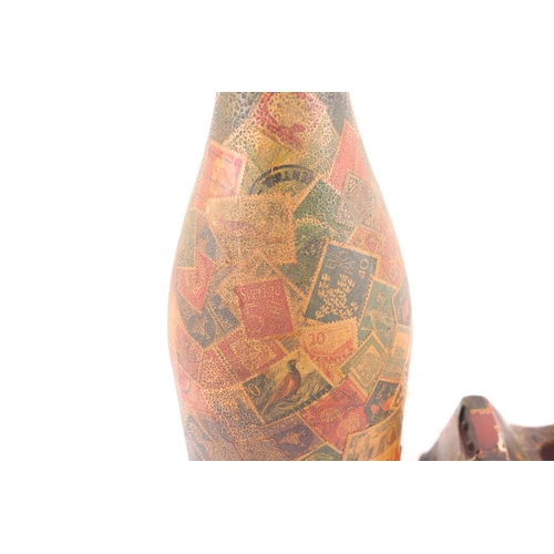 99 - A mid 20th century decoupaged wine bottle appliqued with vintage and antique postage stamps, togethe... 