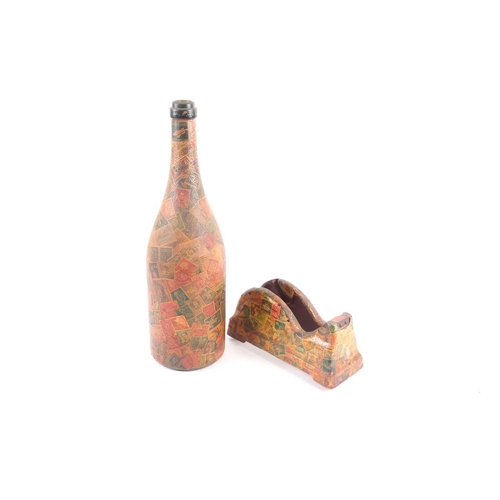 99 - A mid 20th century decoupaged wine bottle appliqued with vintage and antique postage stamps, togethe... 