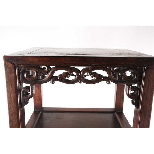100 - A Chinese hongmu official tea table, 19th century, the rectangular top above a pierced and carved st... 