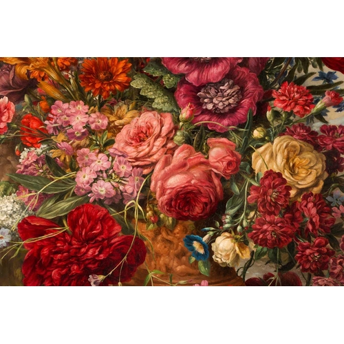 48 - Late 19th or early 20th century school, a large and vibrant still life study of flowers in an urn, a... 