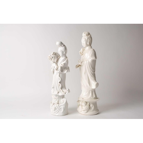 84 - Two Chinese blanc de chine figures, Guanyin & Lan Caihe, 20th century, Guanyin holding a lotus bud, ... 