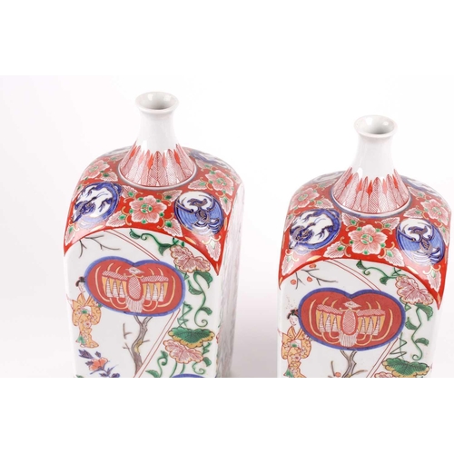 88 - A pair of Arita Imari square vases, circa 1900, based upon gin bottles of the 17th century, the neck... 